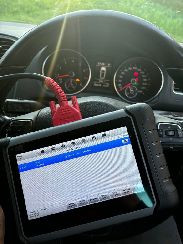 Mobile mechanic using an OBD diagnostic scanner on-site in Perth WA